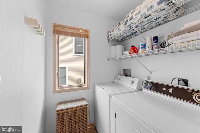 clothes washing area with independent washer and dryer