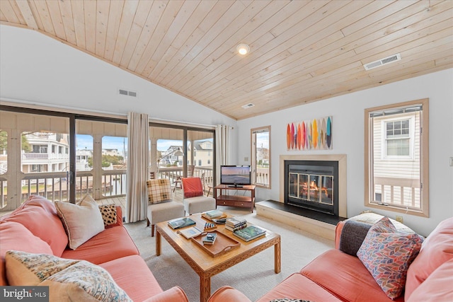 living room featuring light carpet, a wealth of natural light, and wood ceiling