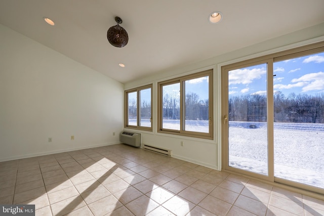 unfurnished sunroom featuring vaulted ceiling, a wall unit AC, baseboard heating, and plenty of natural light