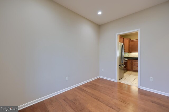 unfurnished room with light hardwood / wood-style flooring