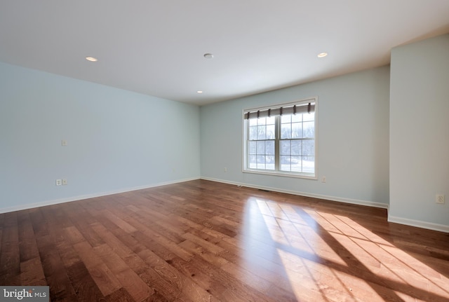 unfurnished room featuring wood-type flooring