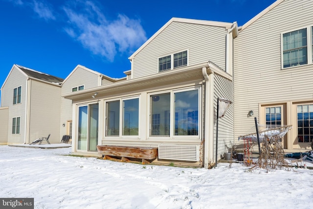 view of snow covered house