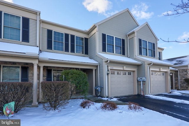 multi unit property featuring a garage