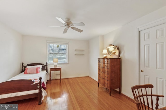 bedroom with ceiling fan and light hardwood / wood-style flooring