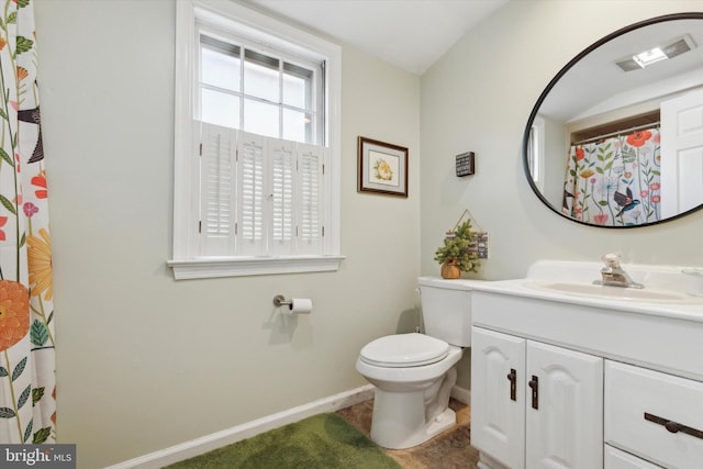 bathroom featuring vanity and toilet