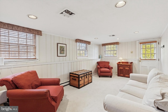 carpeted living room with a baseboard radiator