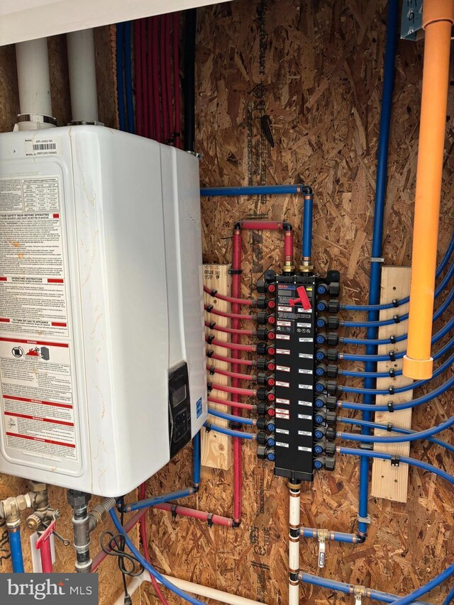 utility room with water heater