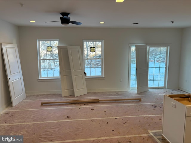 unfurnished room with ceiling fan