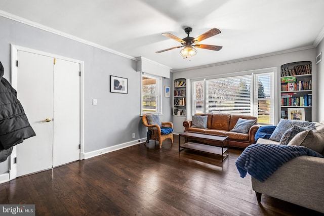 living room with ceiling fan, hardwood / wood-style floors, crown molding, and built in features