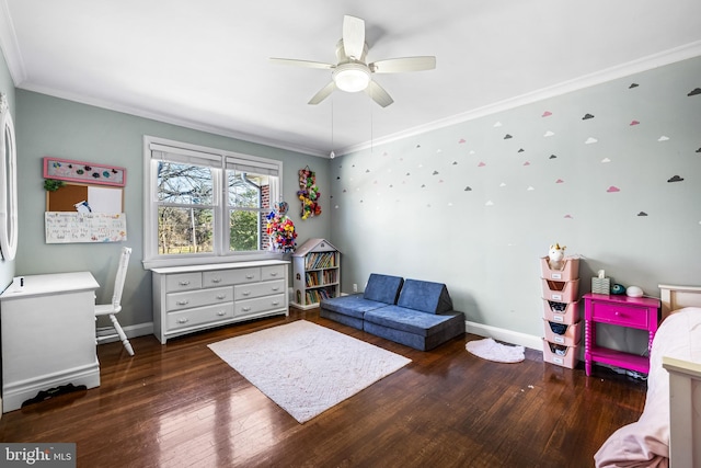 bedroom with ceiling fan, dark hardwood / wood-style floors, and crown molding