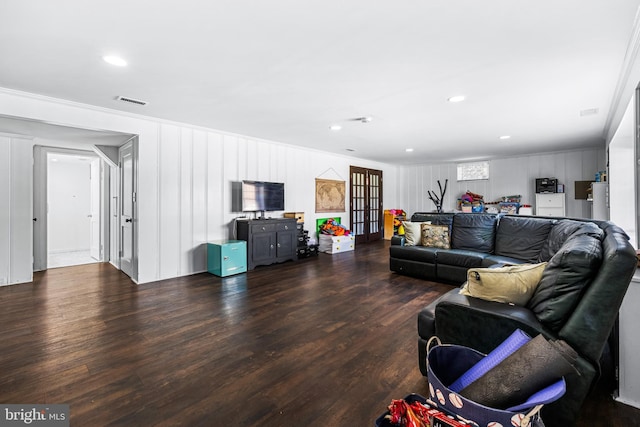 living room with french doors, dark hardwood / wood-style floors, and ornamental molding