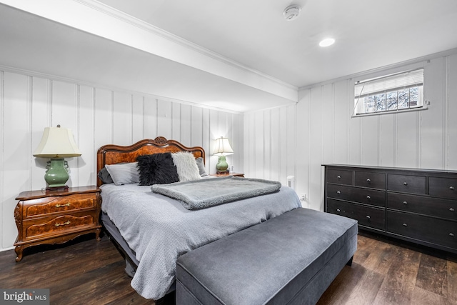 bedroom featuring dark hardwood / wood-style floors and crown molding