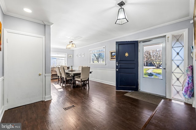 entryway featuring dark hardwood / wood-style floors and ornamental molding