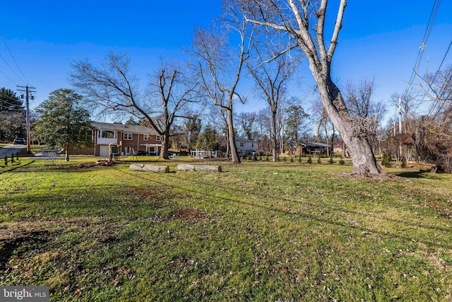 view of yard featuring a garage