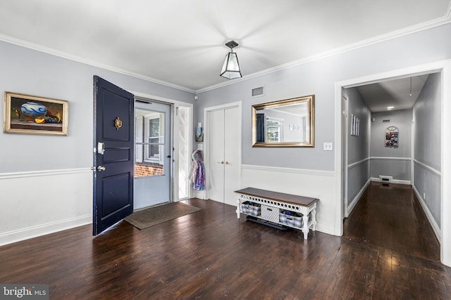 entryway featuring crown molding and dark wood-type flooring