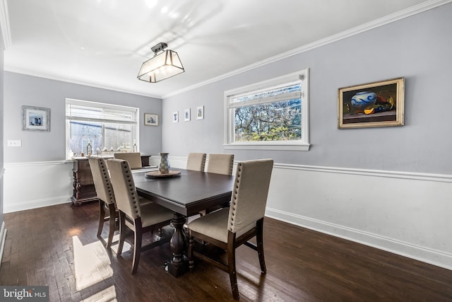 dining area featuring dark hardwood / wood-style floors and ornamental molding