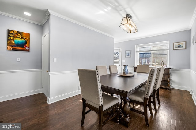 dining room featuring dark hardwood / wood-style flooring and ornamental molding