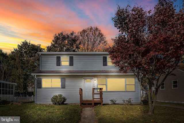 view of front of property with a yard