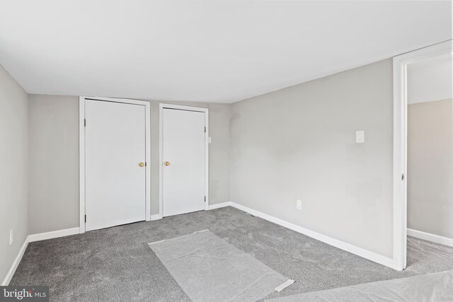 unfurnished bedroom with carpet flooring