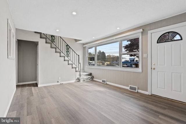 foyer entrance with hardwood / wood-style flooring