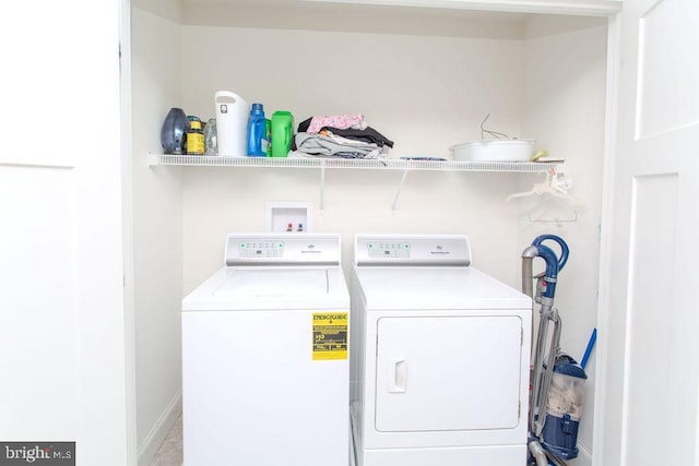 clothes washing area featuring washing machine and dryer