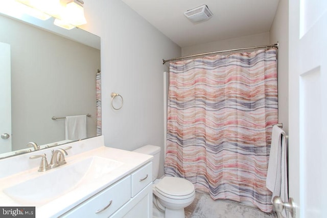 bathroom with vanity, a shower with shower curtain, and toilet