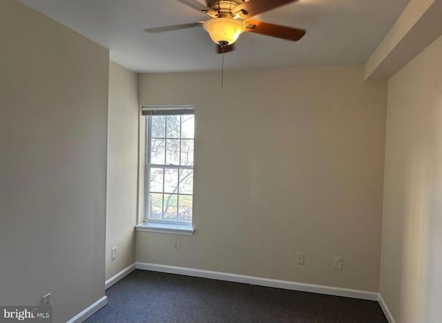 spare room with carpet flooring and ceiling fan