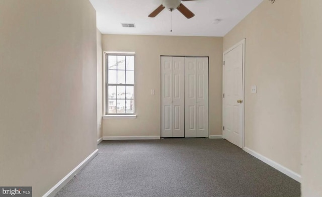 unfurnished bedroom with carpet floors and ceiling fan