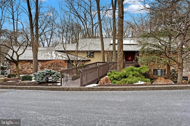 view of front of home with a deck