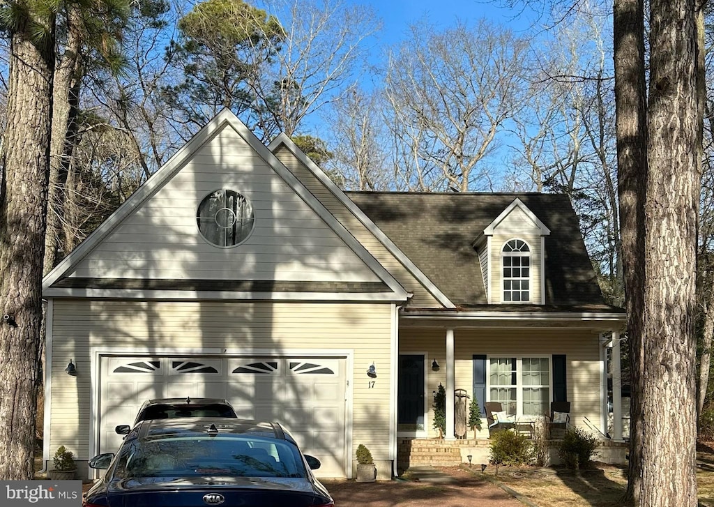 view of front facade featuring a porch and a garage