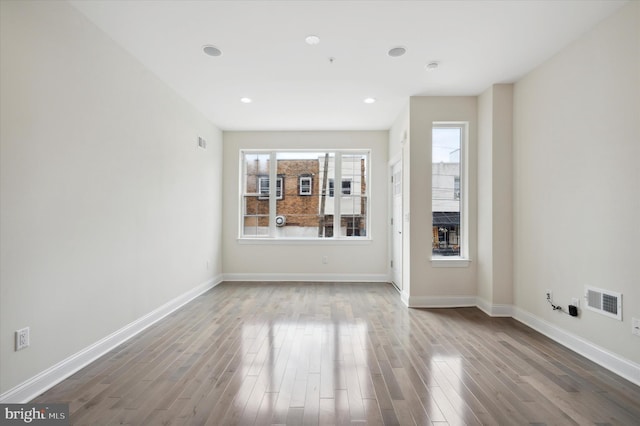 unfurnished living room with a fireplace and light hardwood / wood-style flooring