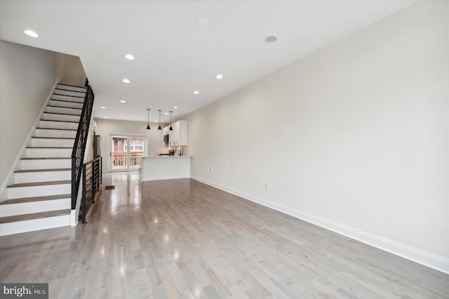 unfurnished living room featuring light hardwood / wood-style flooring