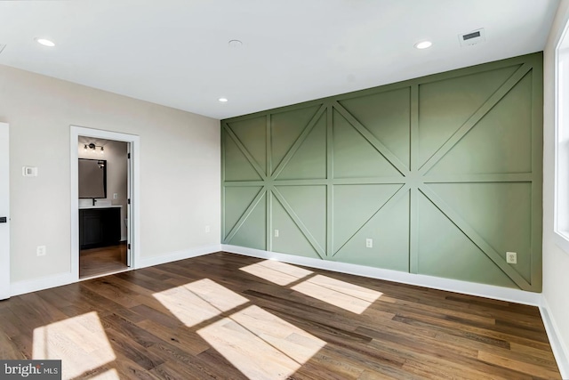 unfurnished room featuring dark hardwood / wood-style floors