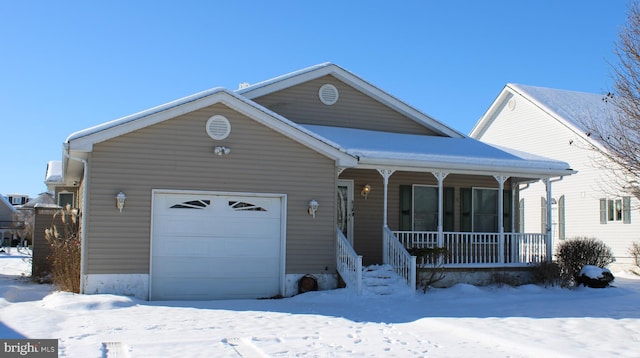 view of front of home with covered porch and a garage