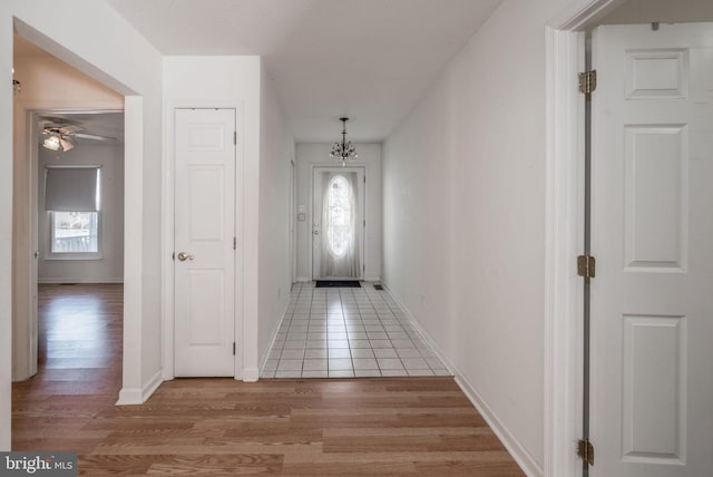 interior space featuring light hardwood / wood-style flooring and a chandelier