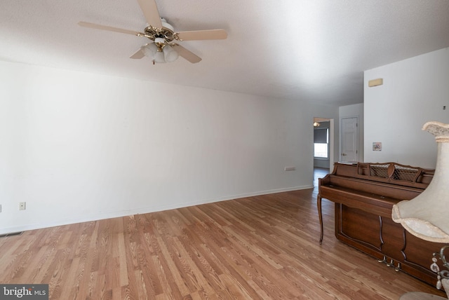 interior space with ceiling fan and hardwood / wood-style flooring