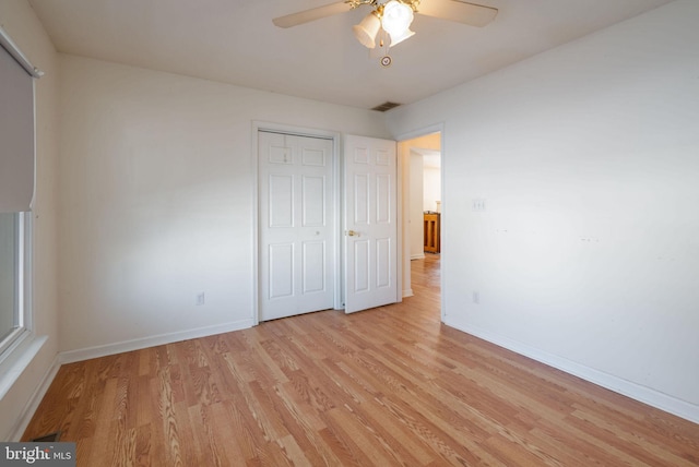 unfurnished bedroom featuring a closet, ceiling fan, and light hardwood / wood-style flooring