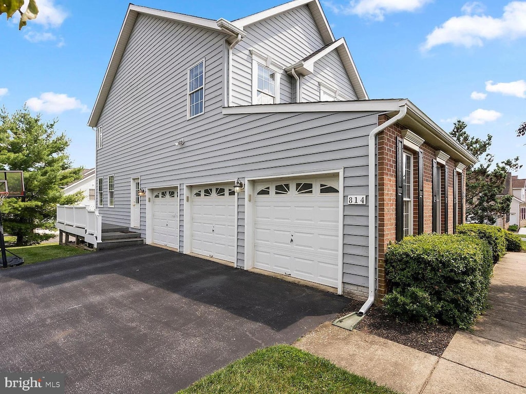 view of side of property featuring a garage