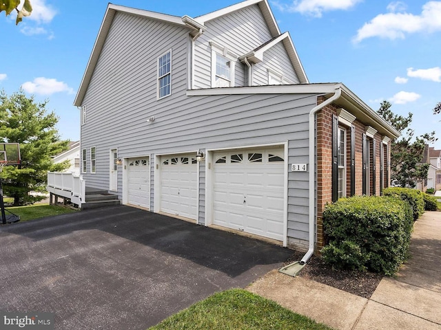 view of side of property featuring a garage