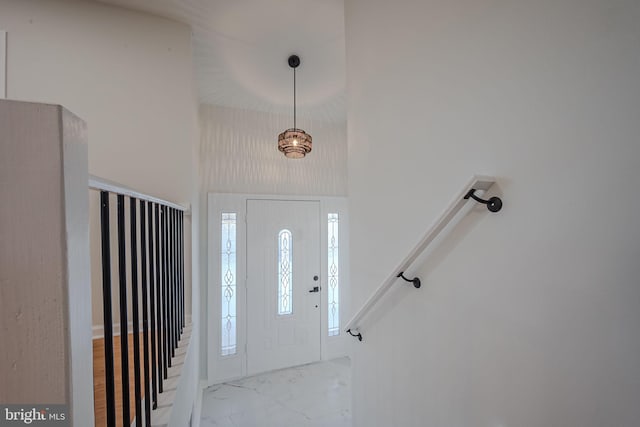 foyer entrance featuring a high ceiling