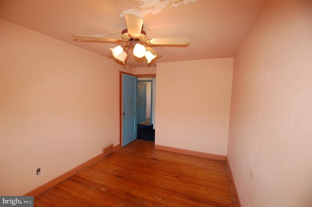 unfurnished room featuring hardwood / wood-style floors and ceiling fan