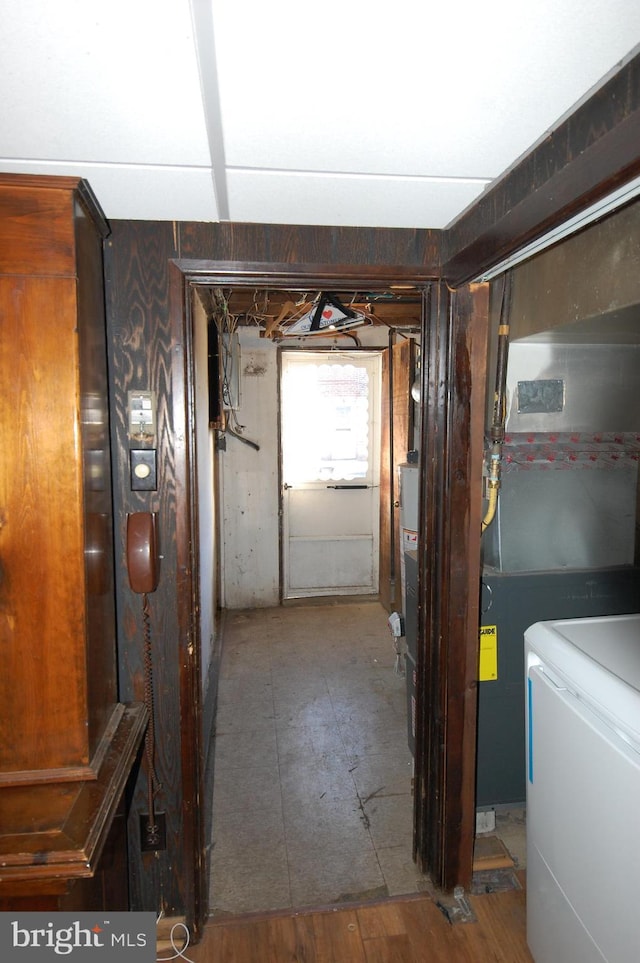 corridor featuring washer / dryer