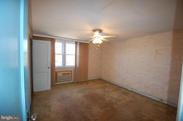 carpeted spare room with a wall mounted AC and ceiling fan