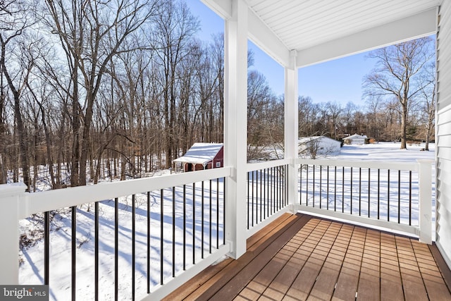 view of snow covered deck