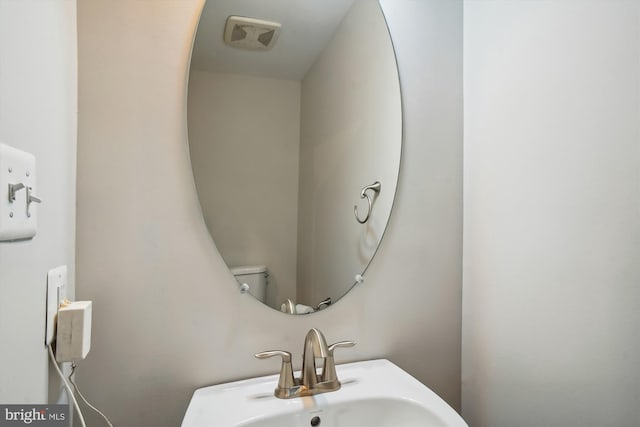 bathroom with toilet and sink