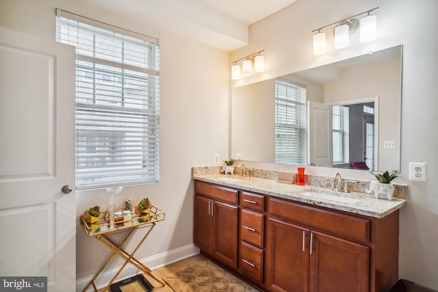 bathroom with tile patterned floors and vanity