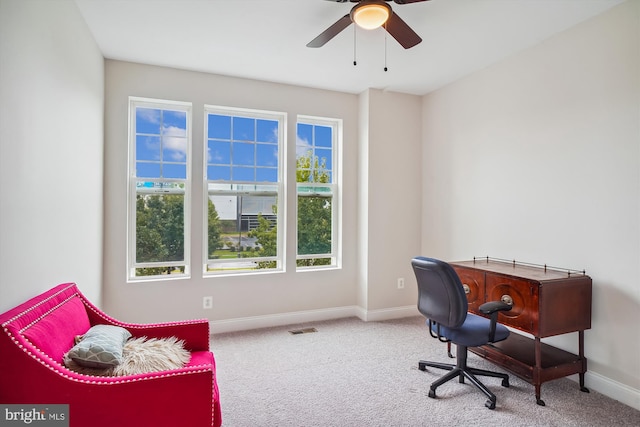 office space featuring ceiling fan and carpet floors