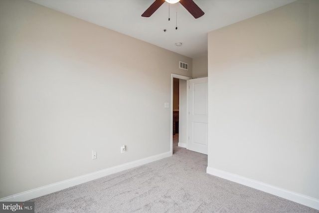 carpeted empty room with ceiling fan