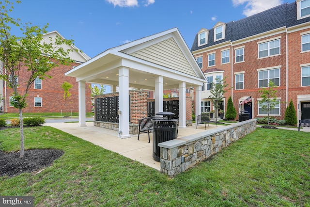 view of community with a gazebo, mail boxes, and a lawn