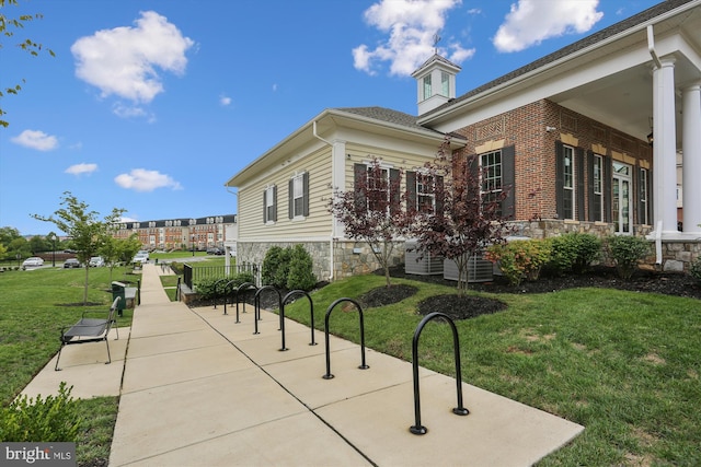 view of side of property featuring a lawn